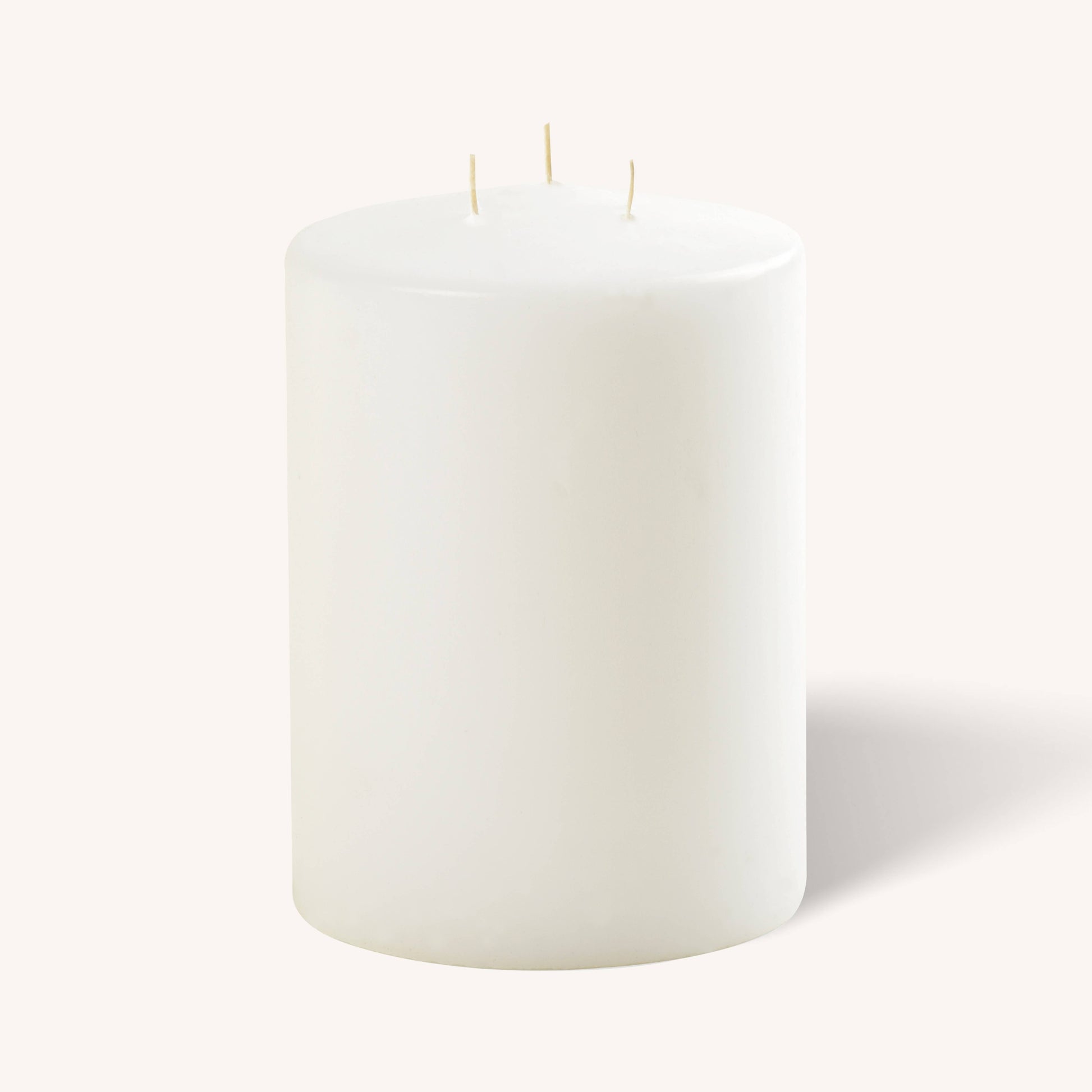 White 3 wick pillar candle, 6 inch by 8 inch